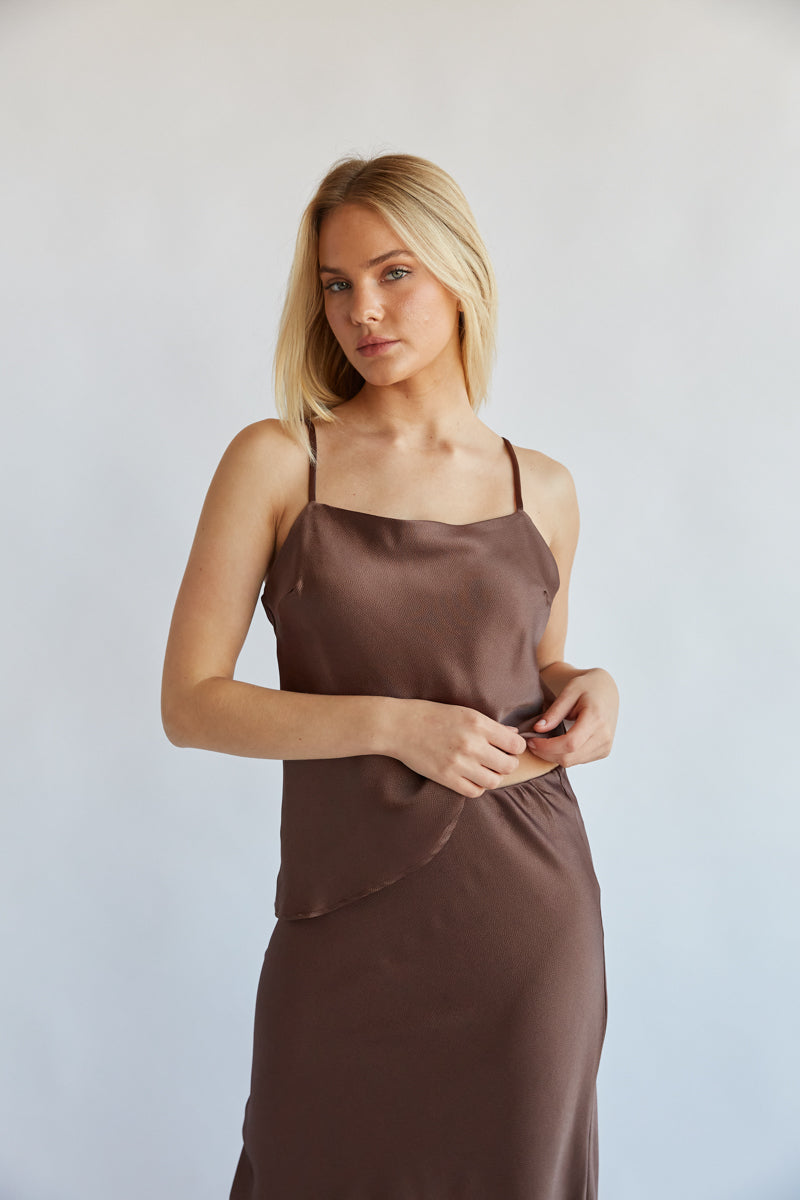 http://www.shopamericanthreads.com/cdn/shop/files/amiri-brown-satin-two-piece-midi-skirt-set-spaghetti-strap-cami-silk-fall-outfit-trendy-boutique-holiday-outfit--012.jpg?v=1696886446&width=1024