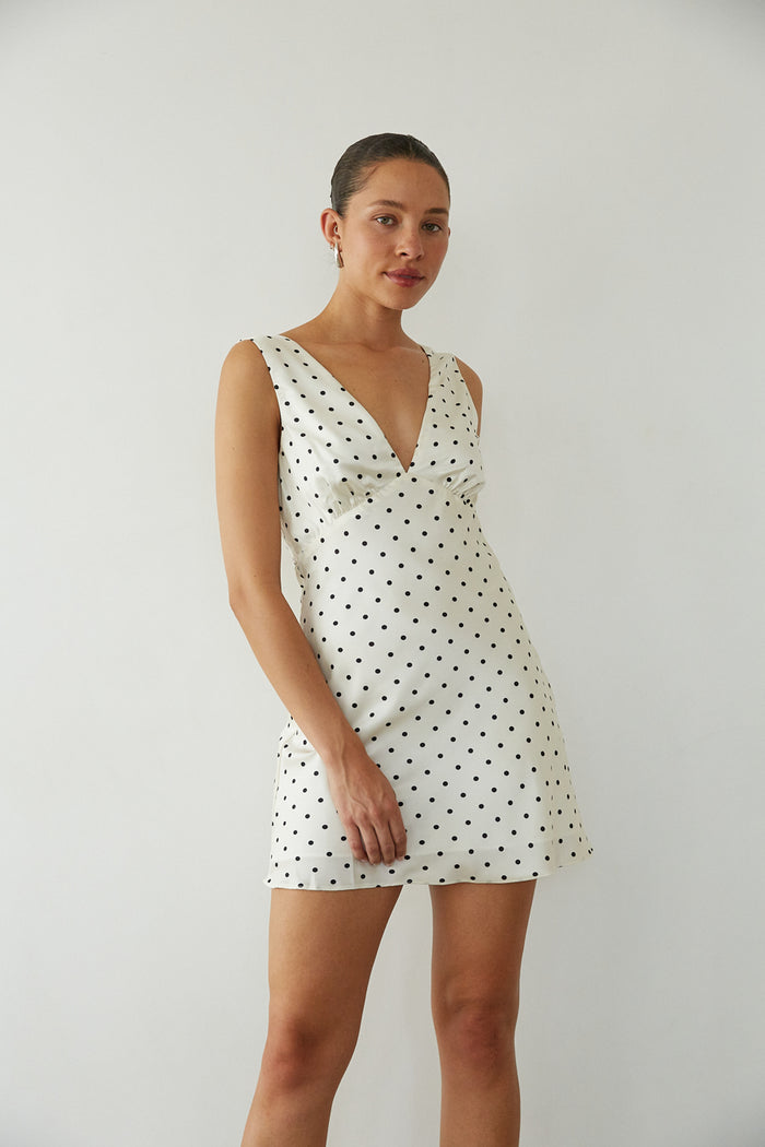 front view | v neck white and black polka dot mini dress