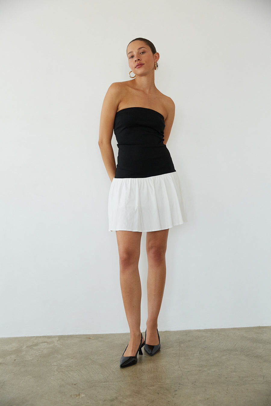 full body view | black and white strapless fit and flare mini dress