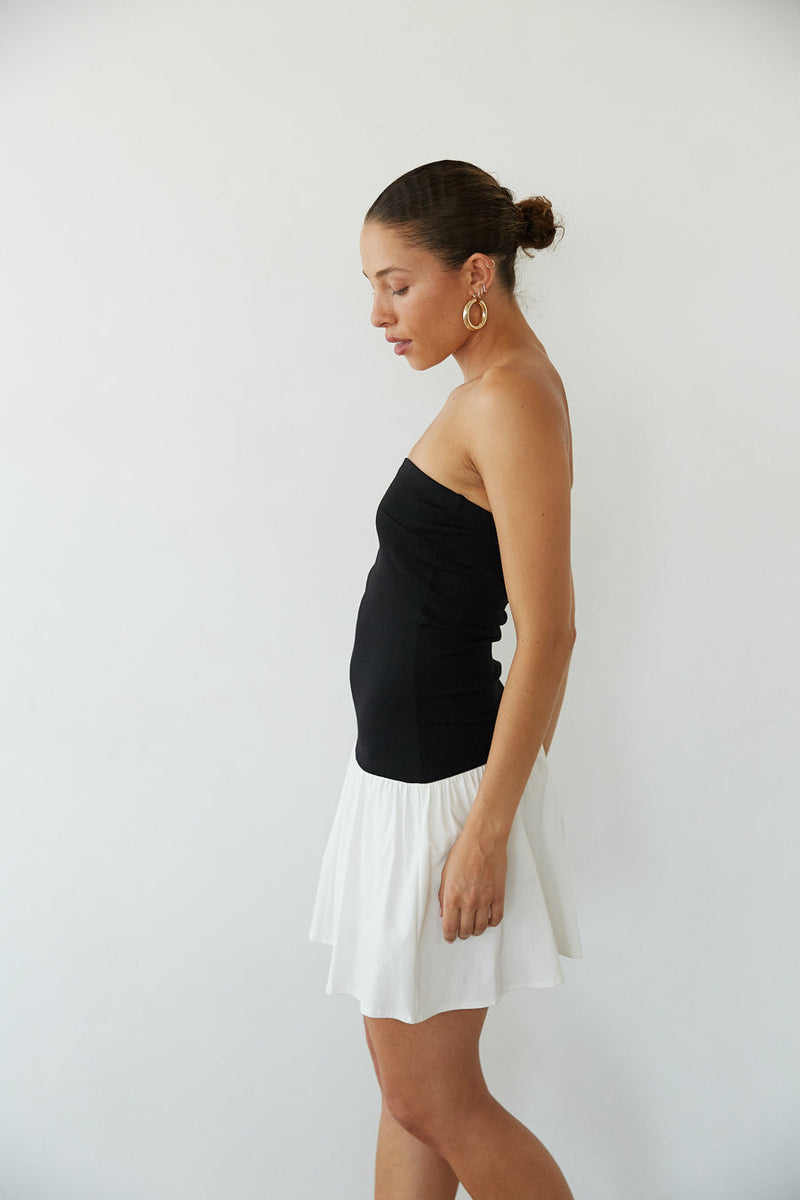 side view | black and white strapless fit and flare mini dress