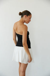 back view | black and white strapless fit and flare mini dress