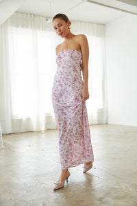 Woman in a strapless floral maxi dress from American Threads, ideal for graduation dresses.