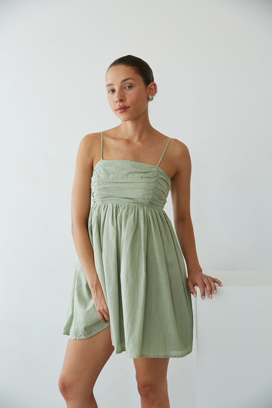 Sage Green-Image | Front View | Pleated bust spag strap open tie back babydoll mini dress | Rush Dress