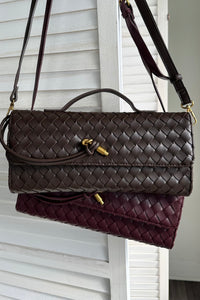 espresso and merlot woven clutch with shoulder strap | long strap hanging view detail shot