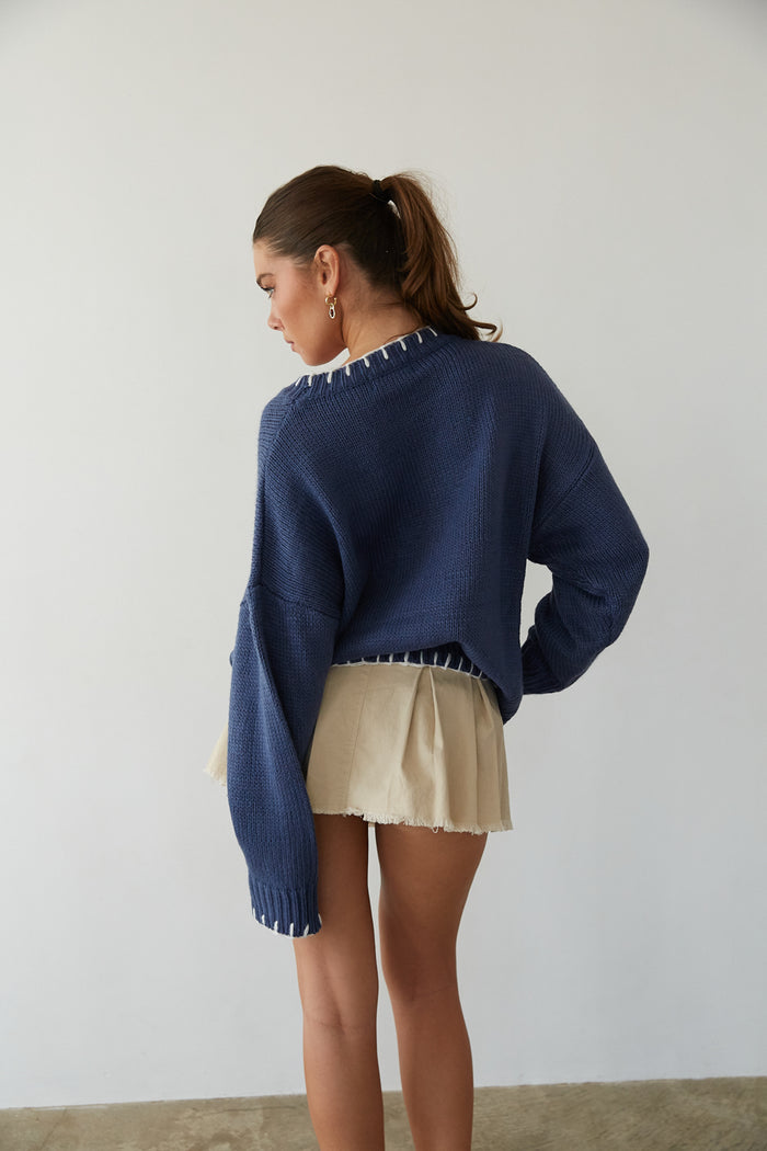 back view | blue chunky knit sweater with white bow print | coquette sweater