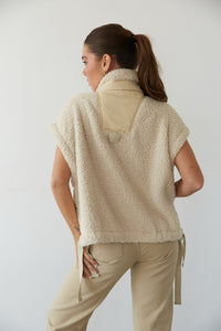 Back view of woman in cozy sweater and cute pants from American Threads, ideal for fall women's clothing.