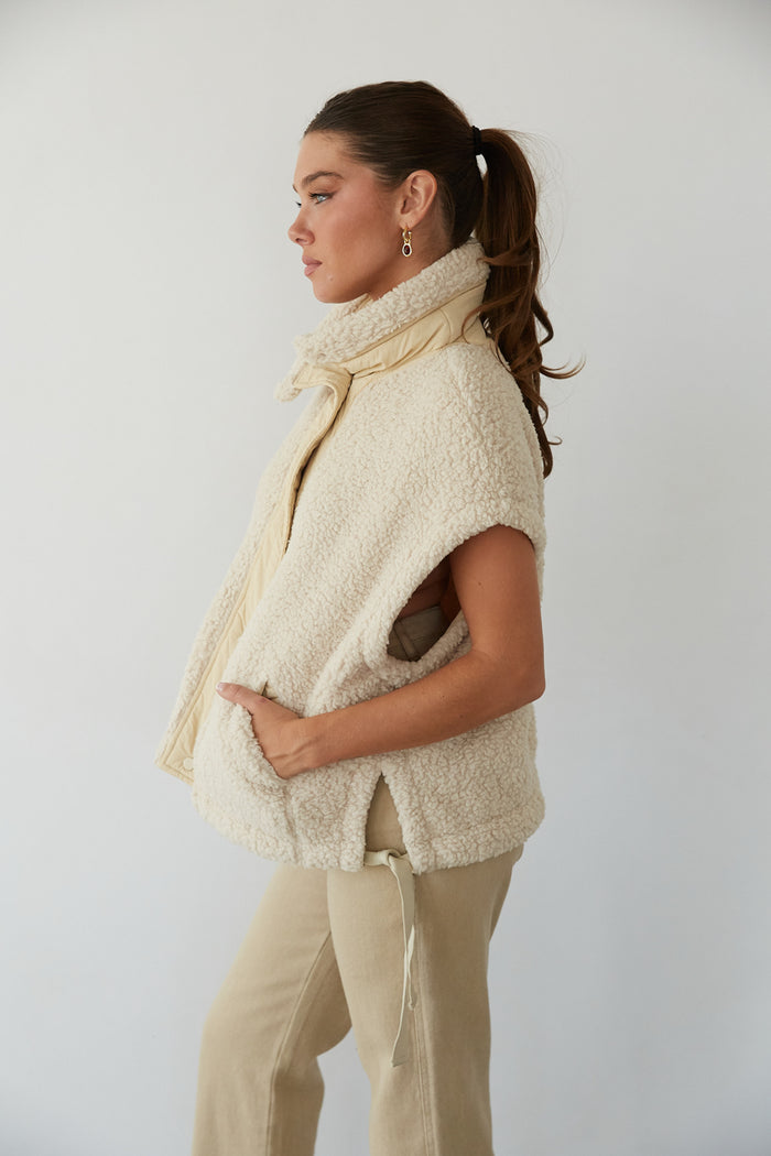 side view | beige tan sherpa plush vest for winter 2024 | cozy must-haves