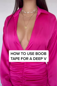 video of woman demonstrating use of body tape - boob tape tutorial